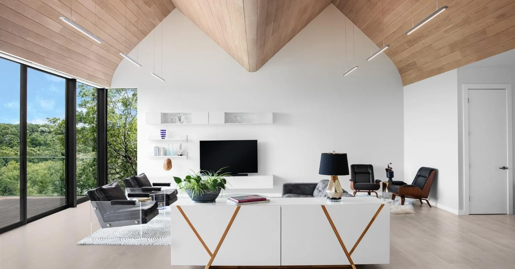 Living room of the Barton Hills Residence with a vaulted wood ceiling, designed by Spaces Designed