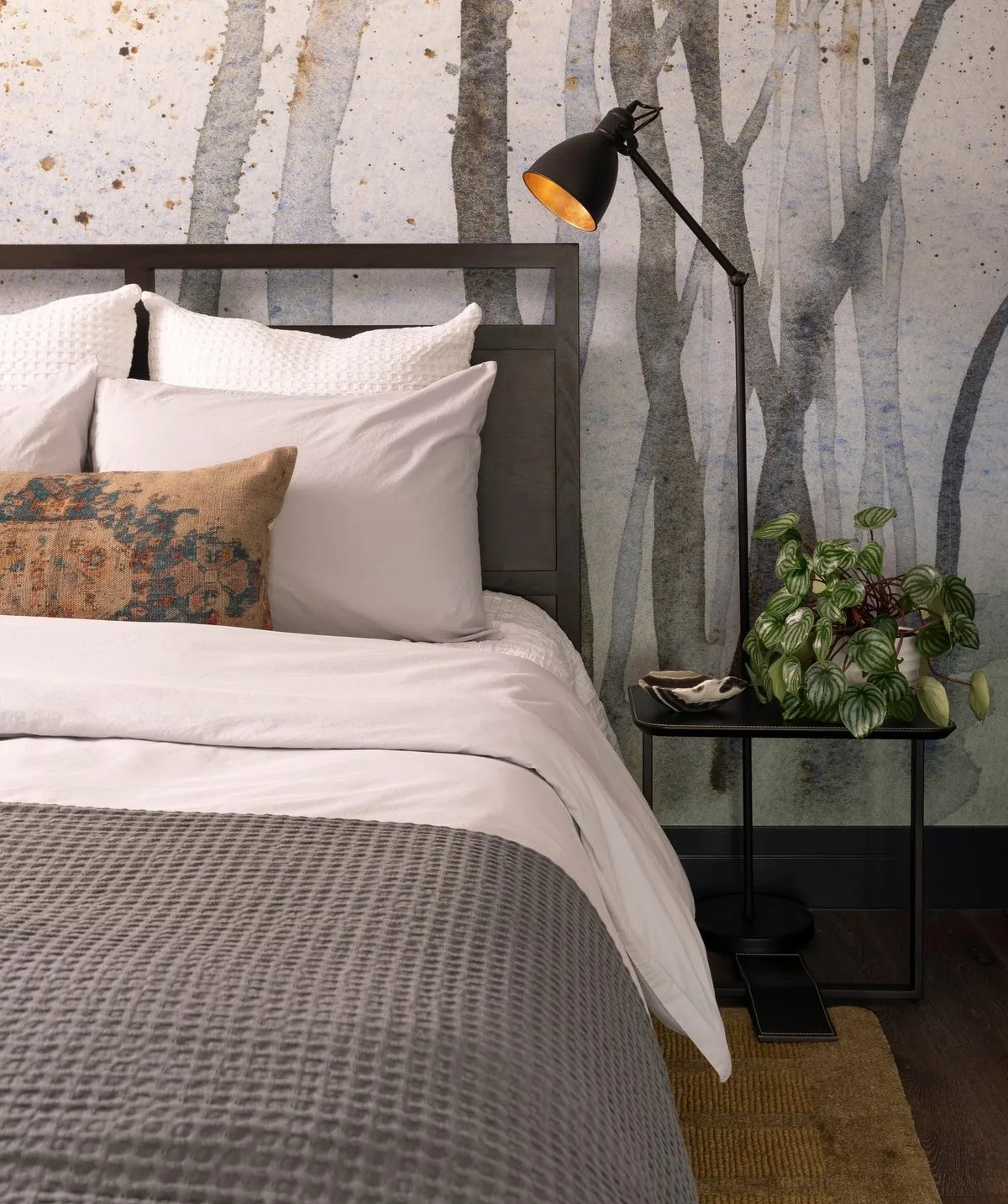 Bedroom of the 5th and West Condo with birch forest wallpaper